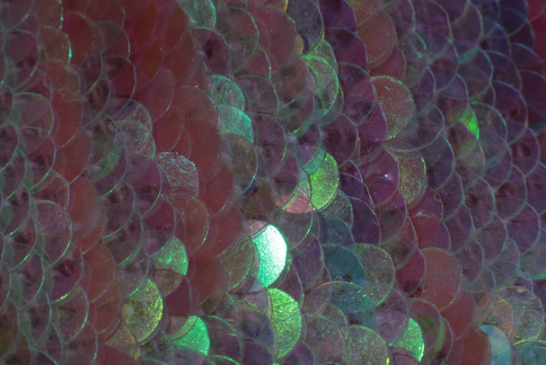 Λαμπερή υφή φόντο ιριδίζουσα πολύχρωμες πούλιες μακροφωτοπαρκινικό εορταστικό  - Φωτογραφία, εικόνα