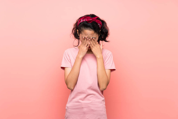 Asian young woman over isolated pink background with tired and sick expression - Фото, изображение