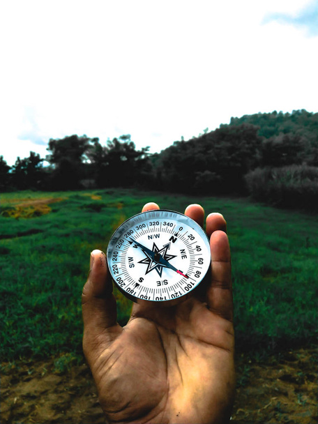 HOLDING COMPASS IN HAND - Photo, Image