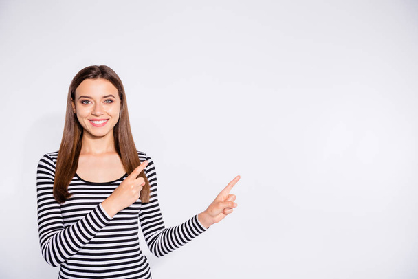 Portrait of her she nice attractive charming lovely cheerful cheery content straight-haired girl pointing two forefingers aside copy space isolated over white light background - Foto, immagini