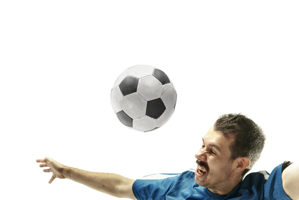 Close up of emotional man playing soccer hitting the ball with the head on isolated white background - Фото, изображение