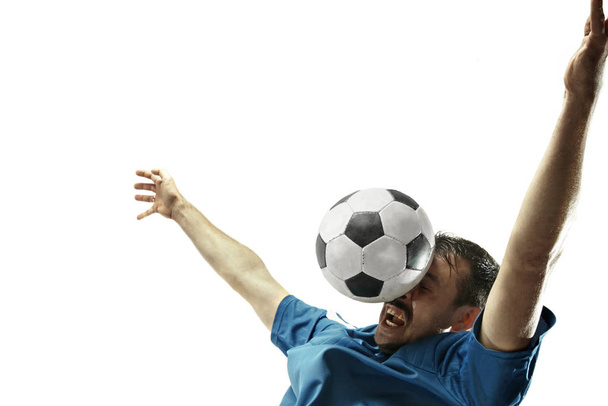 Close up of emotional man playing soccer hitting the ball with the head on isolated white background - Fotó, kép