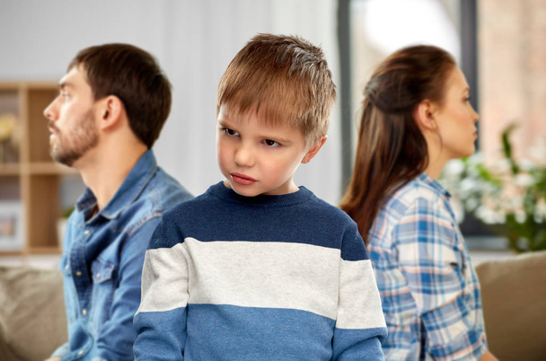 sad little boy with unhappy parents at home - Valokuva, kuva