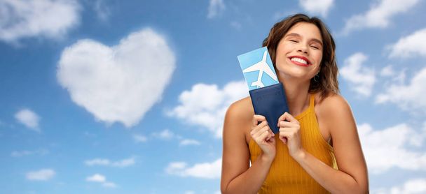 happy young woman with air ticket and passport - Fotoğraf, Görsel