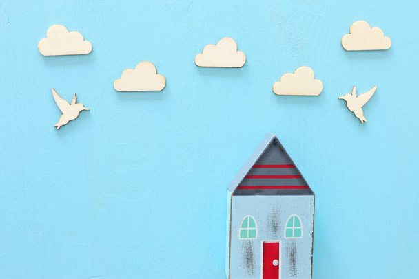image of vintage wooden colorful house decoration on blue pastel background - Foto, afbeelding