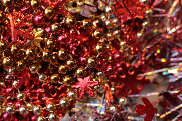 Fondo brillante de Navidad con una guirnalda parpadeante, detalles de decoración brillante de Año Nuevo macro luces de fotos
 - Foto, imagen