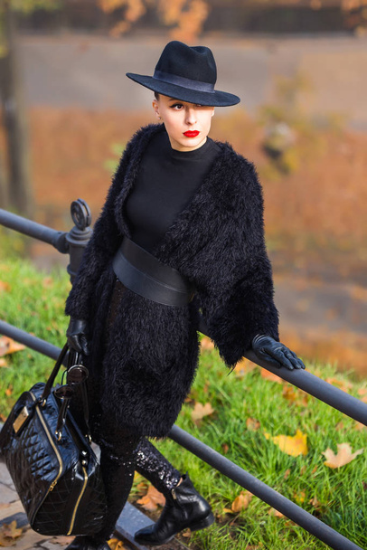 stylish woman in autumn park - 写真・画像