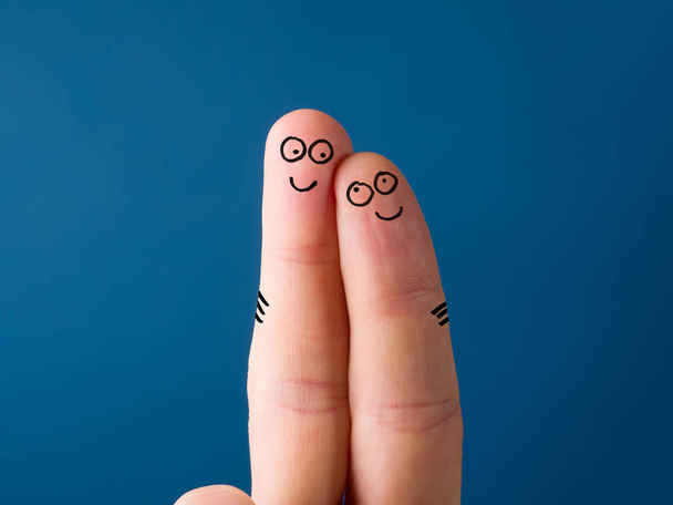 Funny emotional faces painted on fingers. Two fingers pressed together and smiling - Photo, image