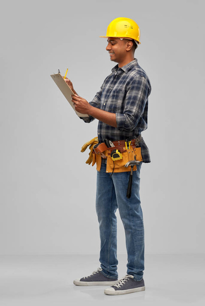 happy builder with clipboard and pencil - Φωτογραφία, εικόνα