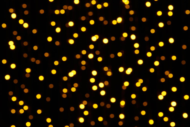 abstract background - photo of yellow bokeh on a black - Photo, Image