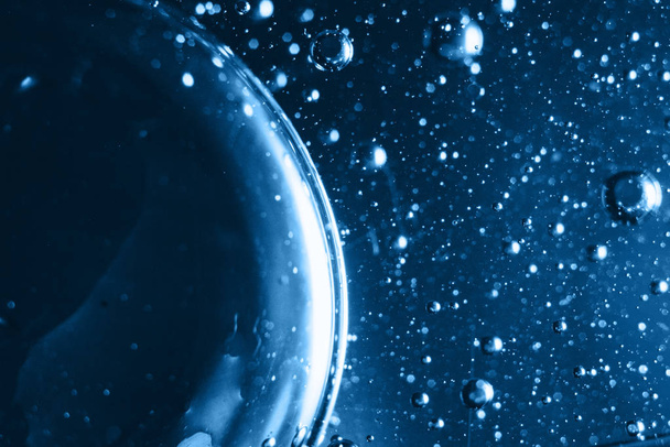 background texture water drops macro concept. design, paint. Planets, universe, space, constellation. atoms, molecules, physics. Fresh classic Pantone 2020 in blue. Color concept of the year. - 写真・画像