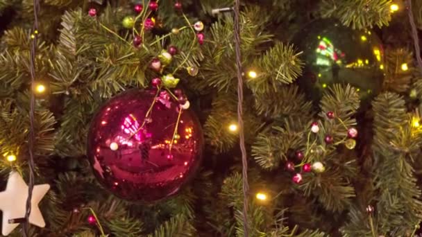 Christmas tree close-up. Toys and lights decorate the Christmas tree - Footage, Video