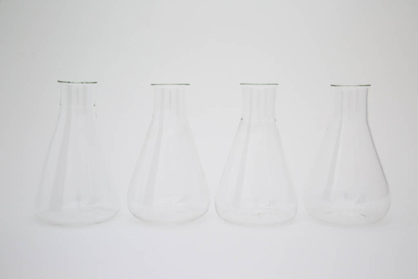 Group of scientific laboratory glass erlenmeyer flask isolated on white background - Φωτογραφία, εικόνα