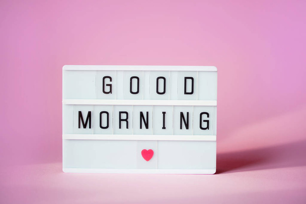 Lightbox with the words good morning on a pink background. - Photo, Image