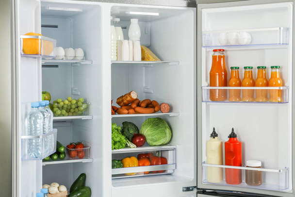Open refrigerator full of different fresh products - Valokuva, kuva