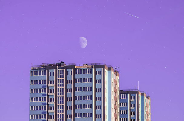 Residential building on a clean colored background, conceptual photo with the moon and stars, texture in Japanese style, purple - Photo, Image