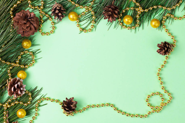Christmas background with fir on green background. Flat lay. Mockup. - Photo, Image