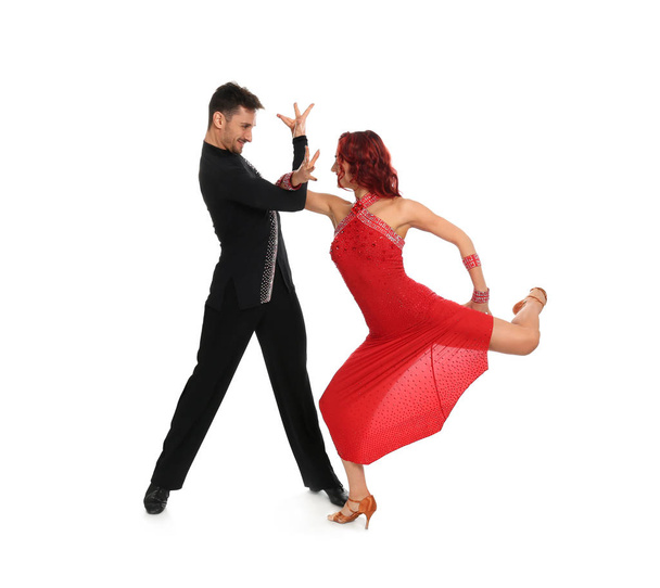 Passionate young couple dancing on white background - Φωτογραφία, εικόνα
