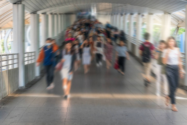 Blurred crowd of unrecognizable business people walking in modern subway interexchange in rush hour working day, blur business and transportation, lifestyle and leisure concept,  - Photo, Image