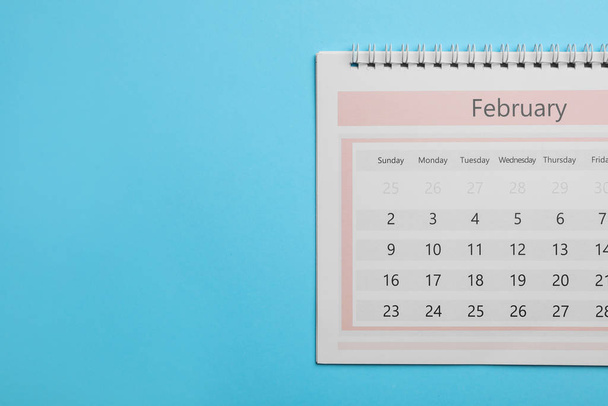 February calendar on light blue background, top view. Space for text - Zdjęcie, obraz
