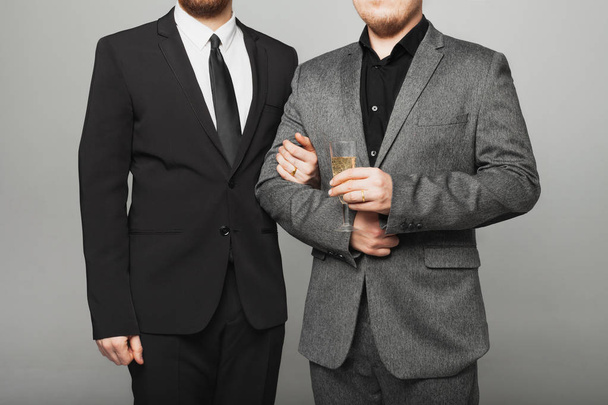 Two men in suits at the LGBTQ wedding - Fotó, kép