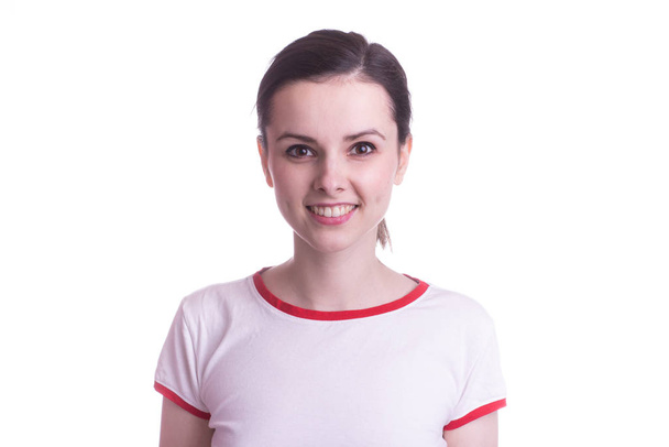 attractive emotional girl in a red and white t-shirt on a white background - Fotoğraf, Görsel