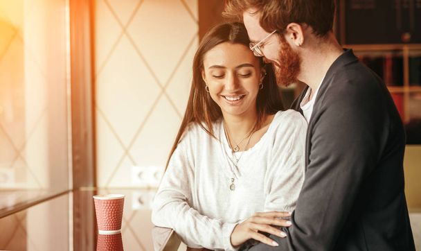 Young couple hugging in cafe - Foto, Bild