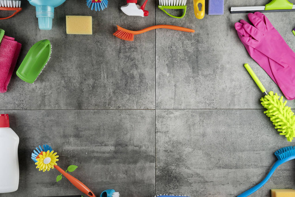 top view of Colorful cleaning products on floor, house cleaning concept - Photo, Image