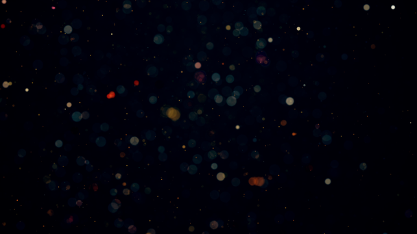 renkli renkli partiküller ile karanlık tatil arkaplanı - Video, Çekim