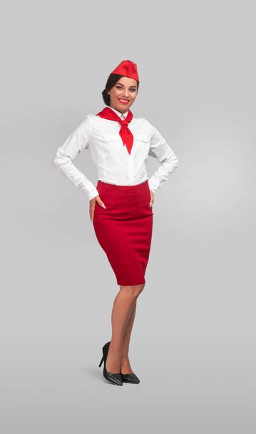 Positive air hostess smiling for camera - Foto, immagini