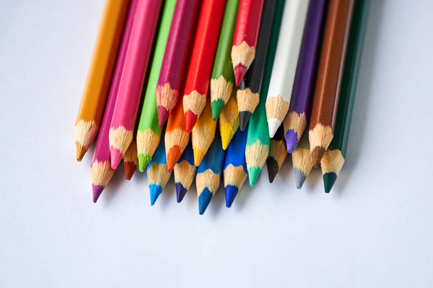 Pile of colored pencils on a white background                                - Foto, imagen