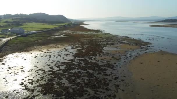 This is an aerial video of flying over the coastline of Donegal Ireland at low tide - Footage, Video
