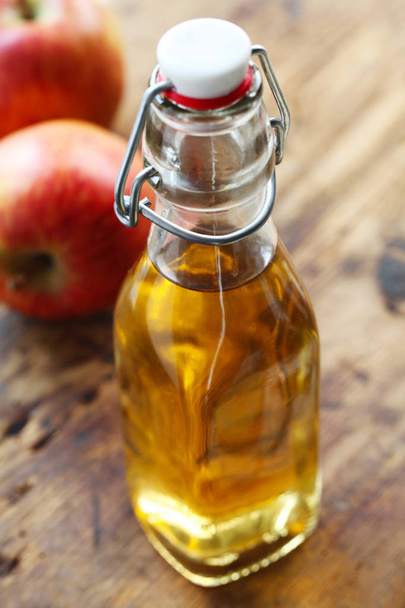 Apple Juice In A Bottle On A Wooden Background - Photo, Image
