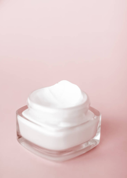 Face cream moisturizer jar on beige background, moisturizing ski - Photo, image