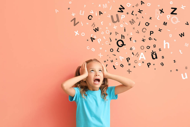 Stressed little girl and many letters on color background - Photo, Image