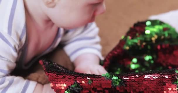 Baby boy with a christmas boot - Imágenes, Vídeo