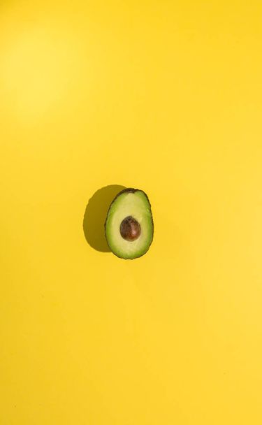 Avocados cut on a background of color - Photo, Image