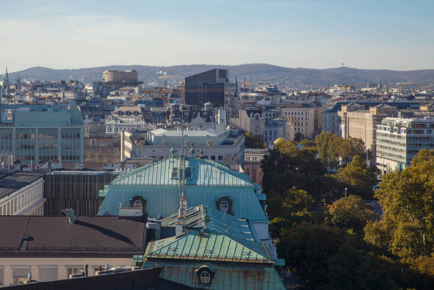 Rooftop view of Vienna city center buildings and small park  - Fotó, kép