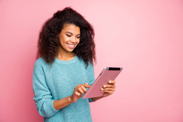 Close-up portrait of her she nice attractive lovely charming cute cheerful cheery wavy-haired girl using wi-fi smart gadget reading news isolated over pink pastel color background - Foto, immagini