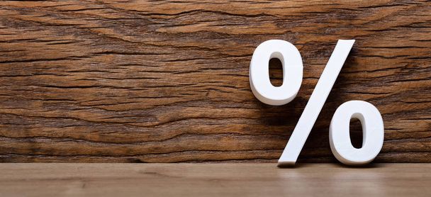 3D White Percentage Sign Against Wooden Wall - Foto, imagen