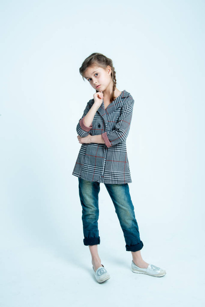 girl kid model in casual style cloth on gray background  - Фото, изображение