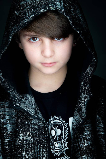 boy studio close up portrait in black zip hoodie on gray background - Foto, Bild