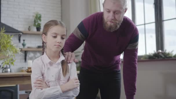Young Caucasian man talking with sad daughter at home. Upset teenage girl sharing problems with father. Trust, reliance, care, childhood, adolescence. - Felvétel, videó