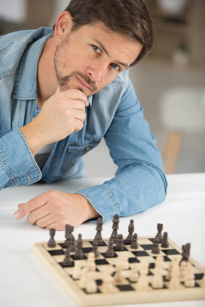 man thinking how to play chess - Fotó, kép