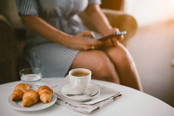  coffee and croissants with woman on background  - Zdjęcie, obraz