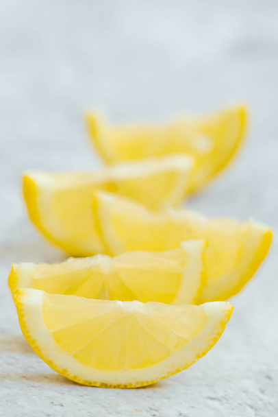 close-up of lemons slices on gray background  - 写真・画像