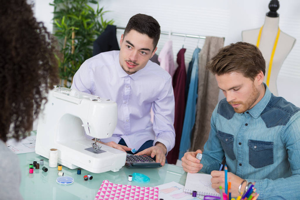 Young people doing craft project with sewing machine - Фото, зображення
