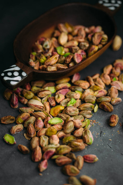 Delicious pistachios with shells, close-up - 写真・画像