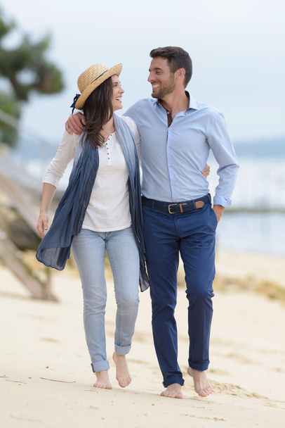 full length view of couple walking along the beach - Φωτογραφία, εικόνα