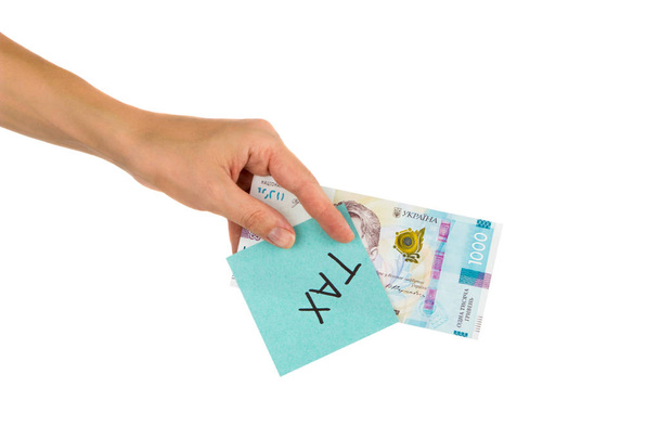 Thousand hryvnias and sticker with different financial signs and symbols in the hand - Photo, image